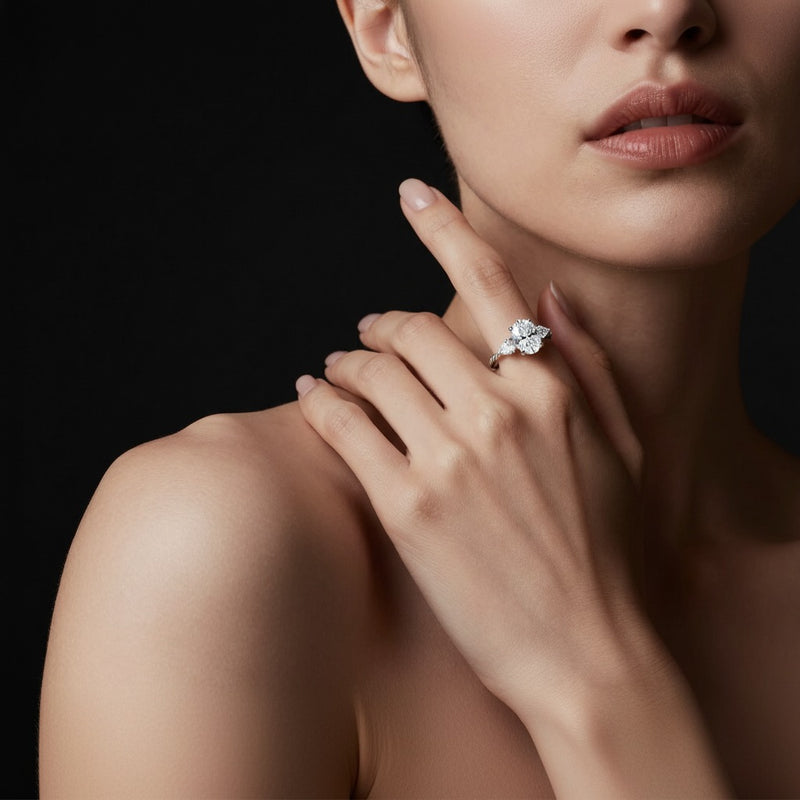 Model wearing oval three stone twisted band engagement ring