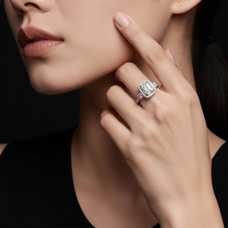 Model wearing cushion accented three stone ring