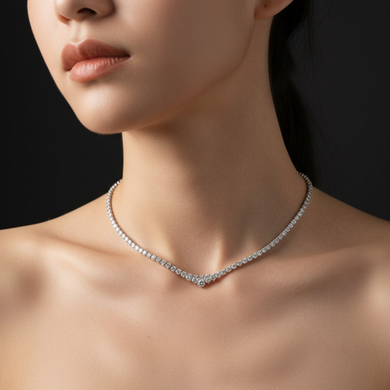 Model wearing round three prong graduating necklace