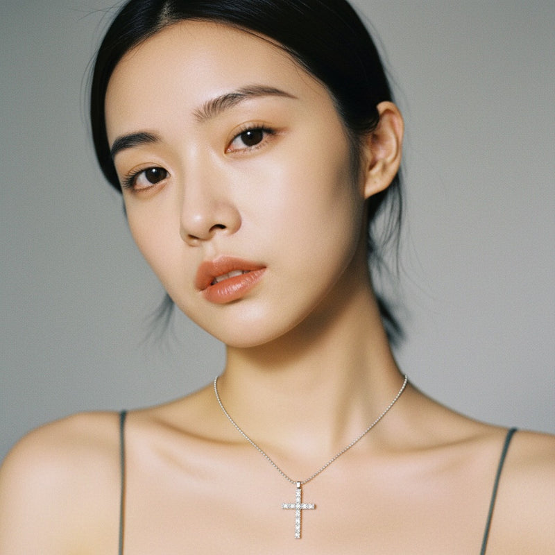 Model wearing oval cross pendant