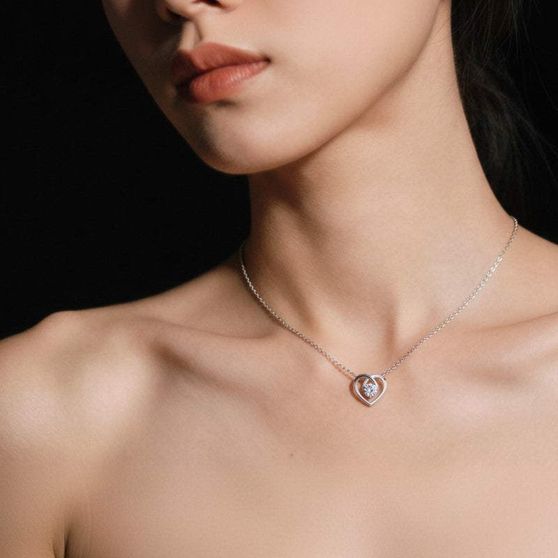 Model wearing heart pendant