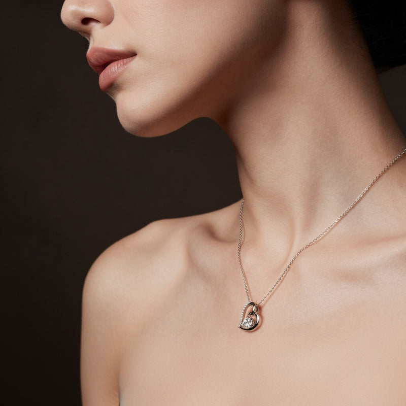 Model wearing heart pendant
