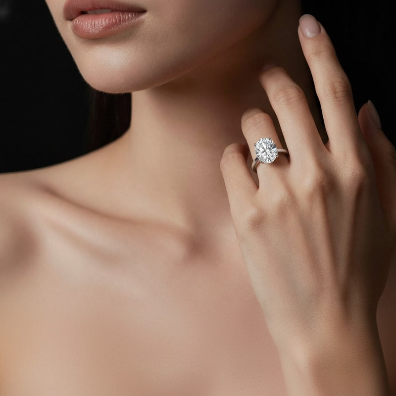 Model wearing oval east west accented ring