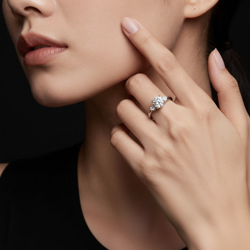 Model wearing pear east west accented ring