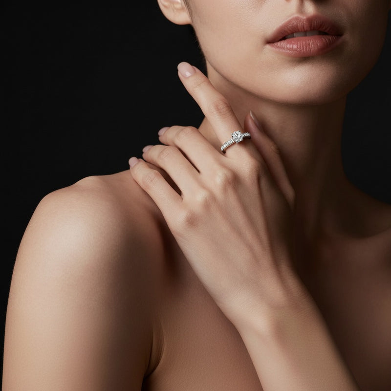 Model wearing oval solitaire engagement ring