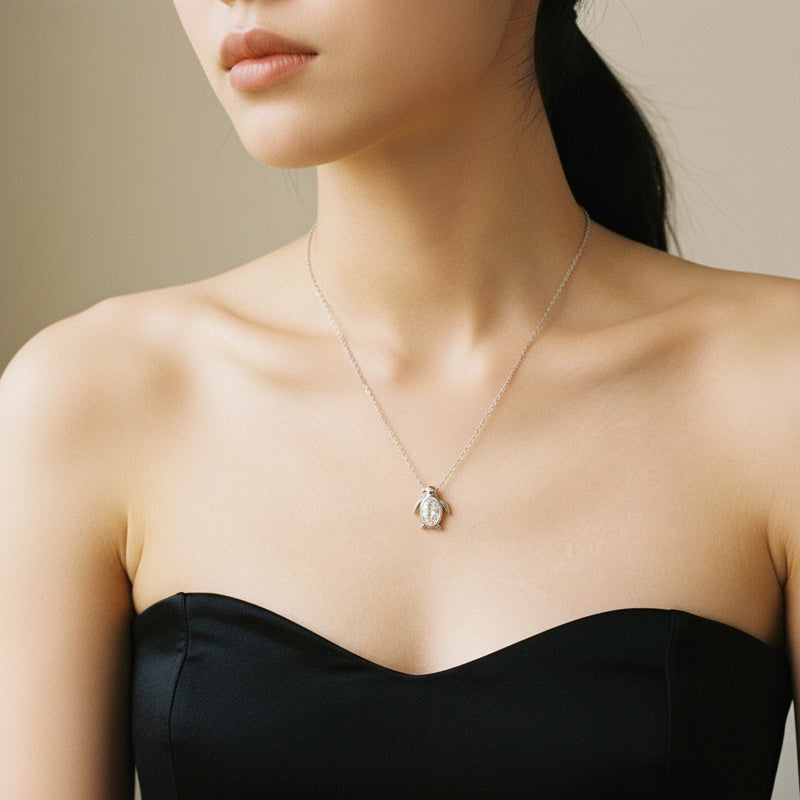 Model wearing oval pendant