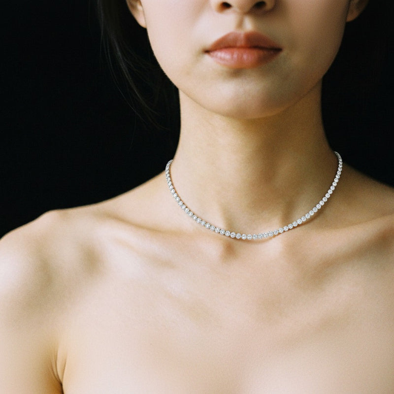 Model wearing round bezel set tennis necklace