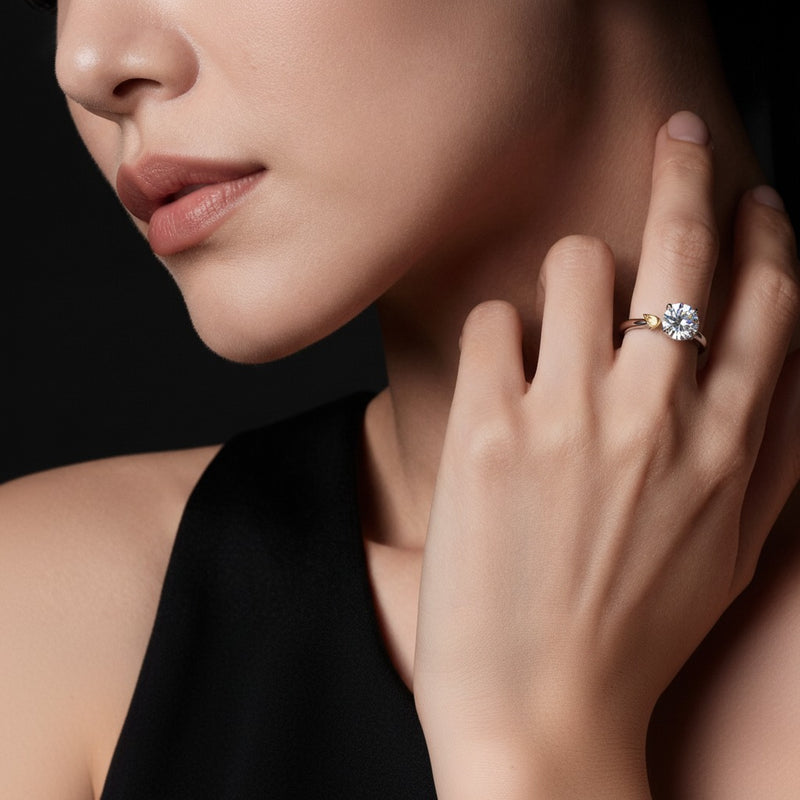 Model wearing round two tone classic solitaire engagement ring
