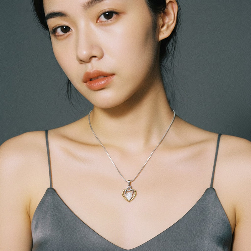 Model wearing heart pendant
