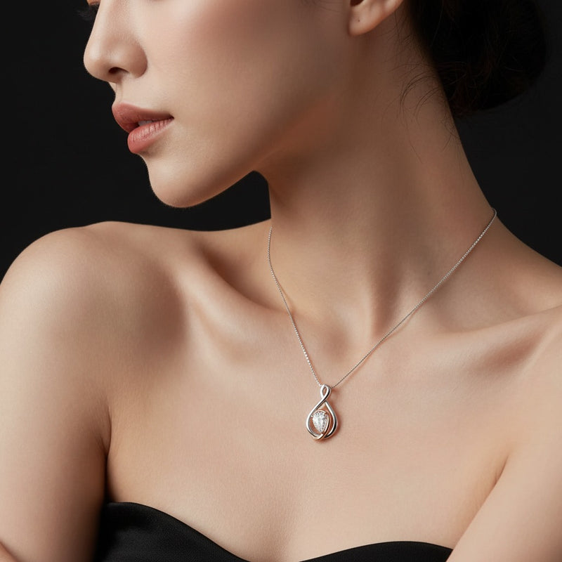 Model wearing pear fancy solitaire pendant