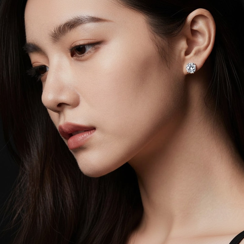 Model wearing round stud earrings