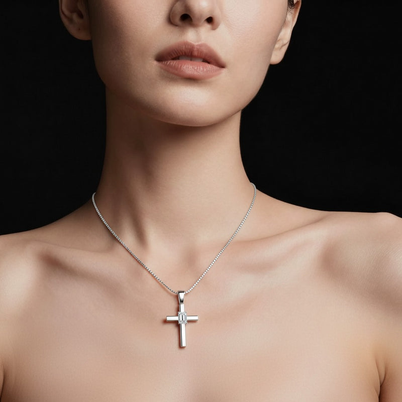Model wearing emerald cross pendant