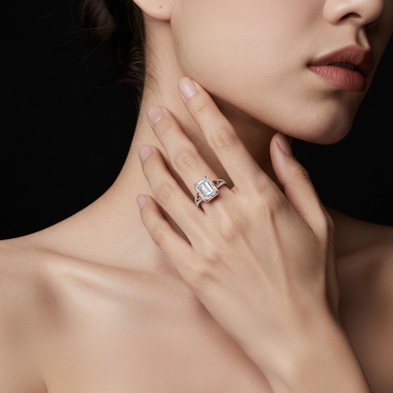 Model wearing emerald bold accented two tone engagement ring