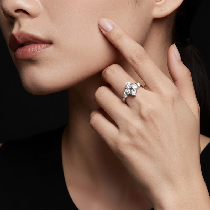 Model wearing round three stone ring