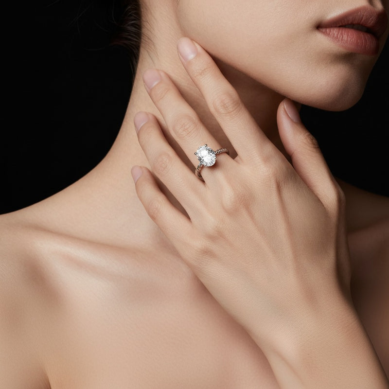 Model wearing marquise petite solitaire engagement ring