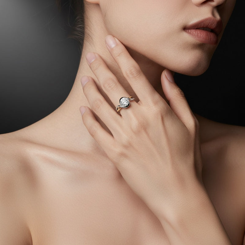 Model wearing round solitaire engagement ring