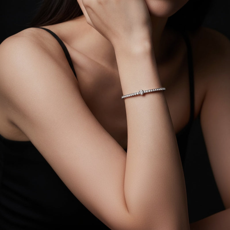 Model wearing oval lab grown diamond north south bracelet