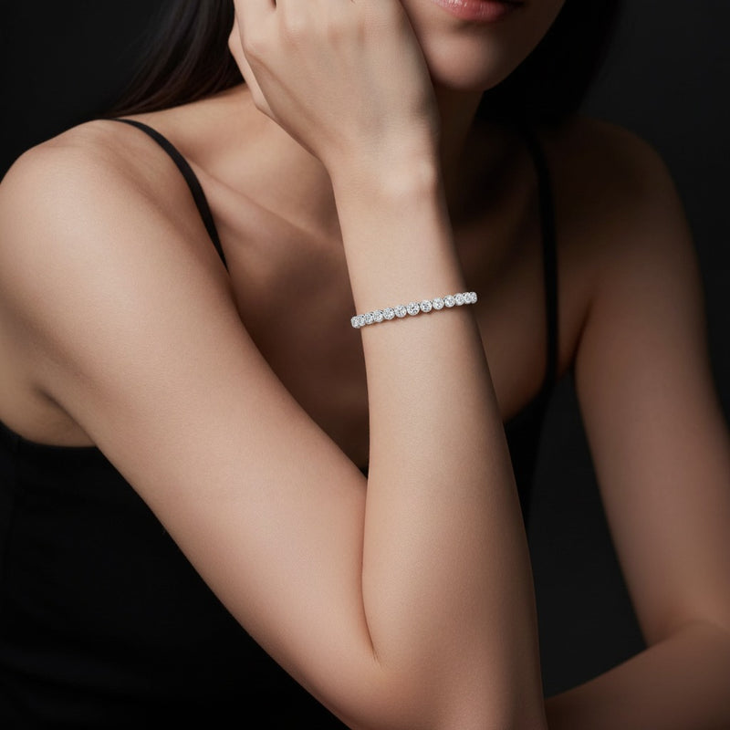 Model wearing round east west bezel set bracelet
