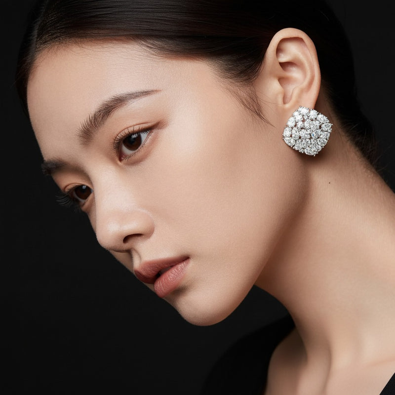 Model wearing oval fashion earrings