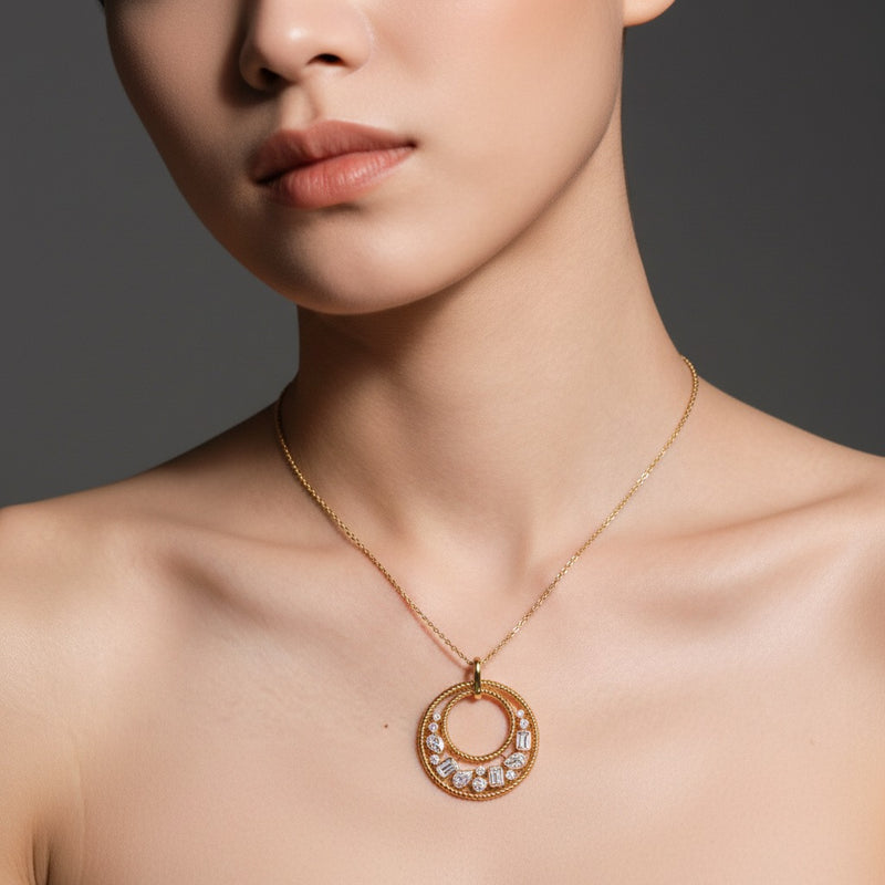Model wearing emerald bezel set bubble pendant