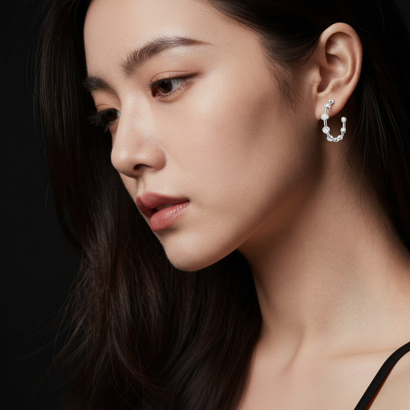 Model wearing round bezel set bubble earrings