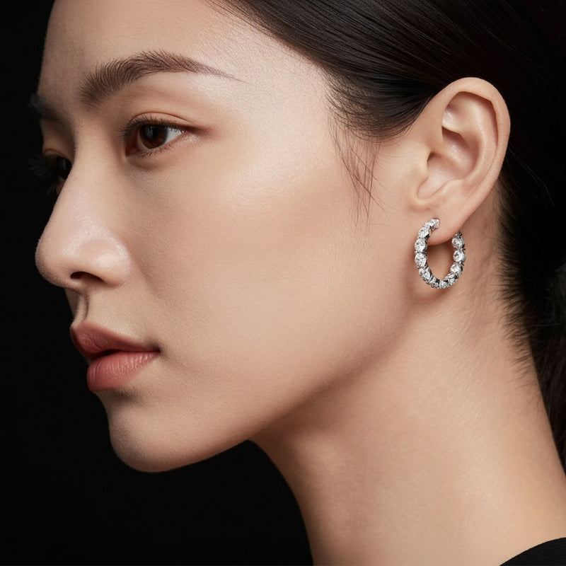 Model wearing oval lab grown diamond inside out hoop earrings