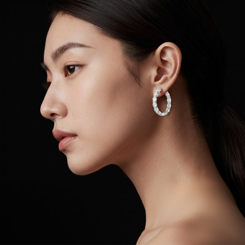 Model wearing oval lab grown diamond inside out hoop earrings