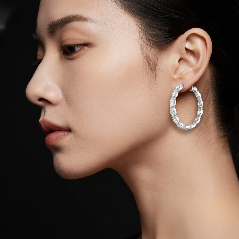 Model wearing oval lab grown diamond inside out hoop earrings