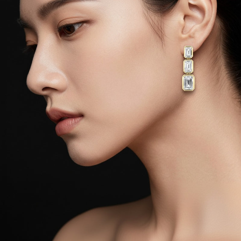 Model wearing emerald lab grown diamond earrings