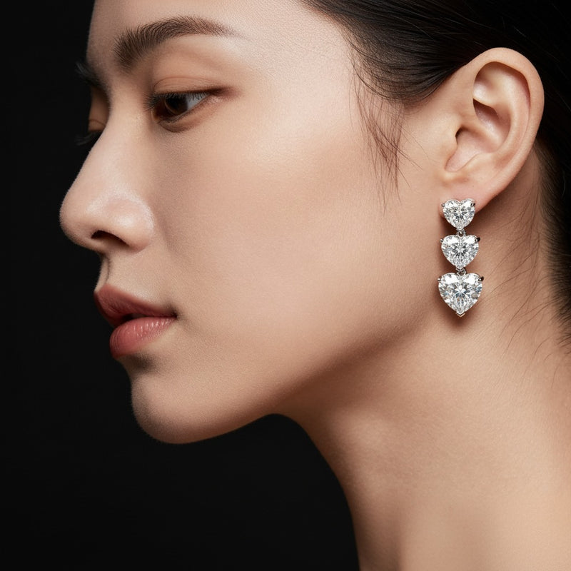 Model wearing heart earrings