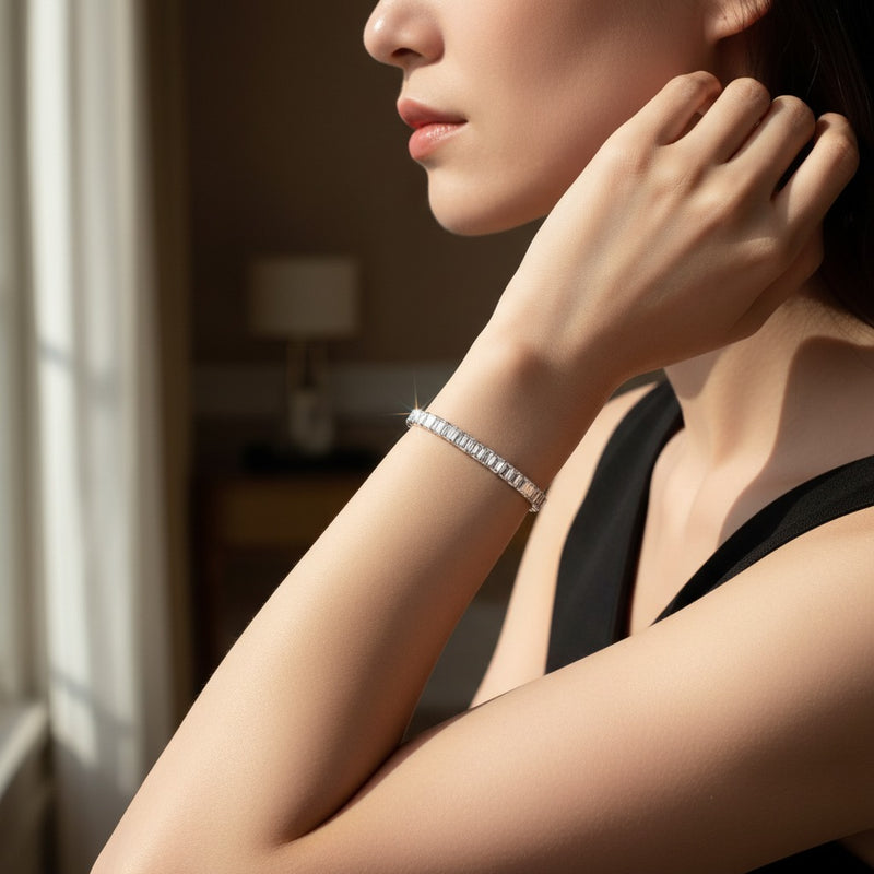 Model wearing emerald lab grown diamond east west bracelet