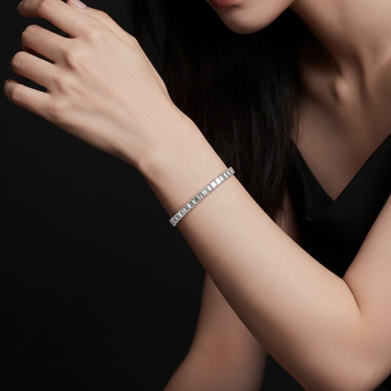 Model wearing emerald lab grown diamond east west bracelet