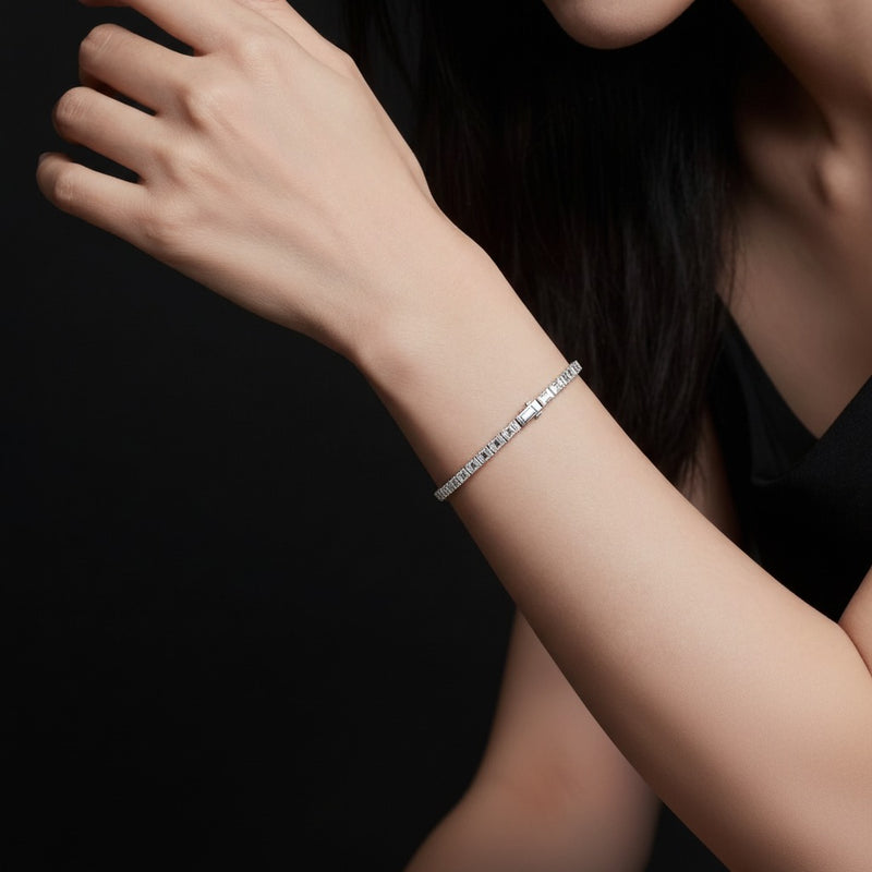 Model wearing emerald lab grown diamond east west bracelet