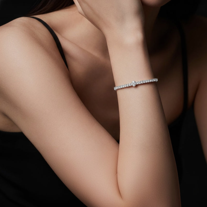Model wearing oval lab grown diamond east west bracelet