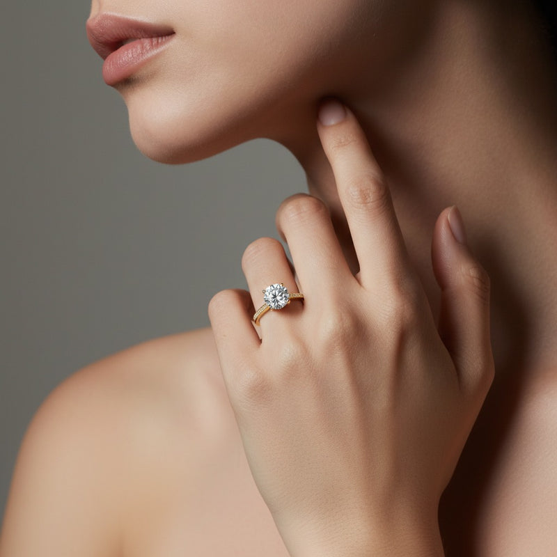 Model wearing round accented solitaire engagement ring