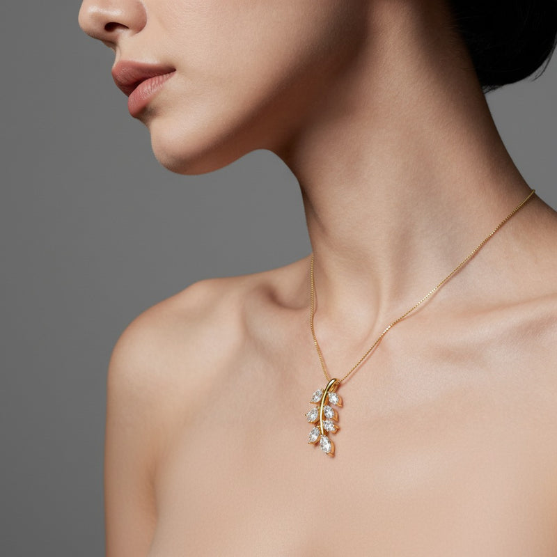 Model wearing marquise leaf motif fashion pendant