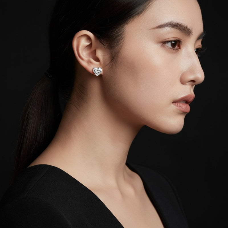 Model wearing heart stud earrings
