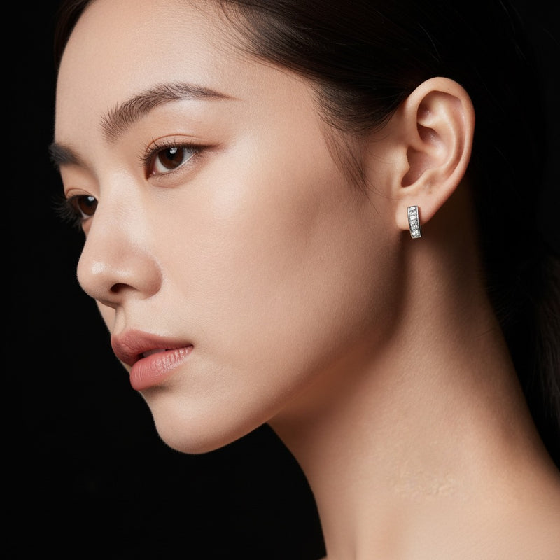 Model wearing princess stud earrings