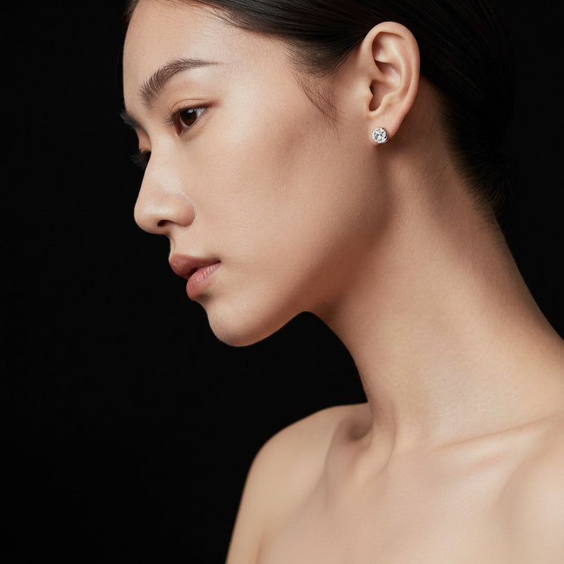 Model wearing round lab grown diamond 4 prong stud earrings