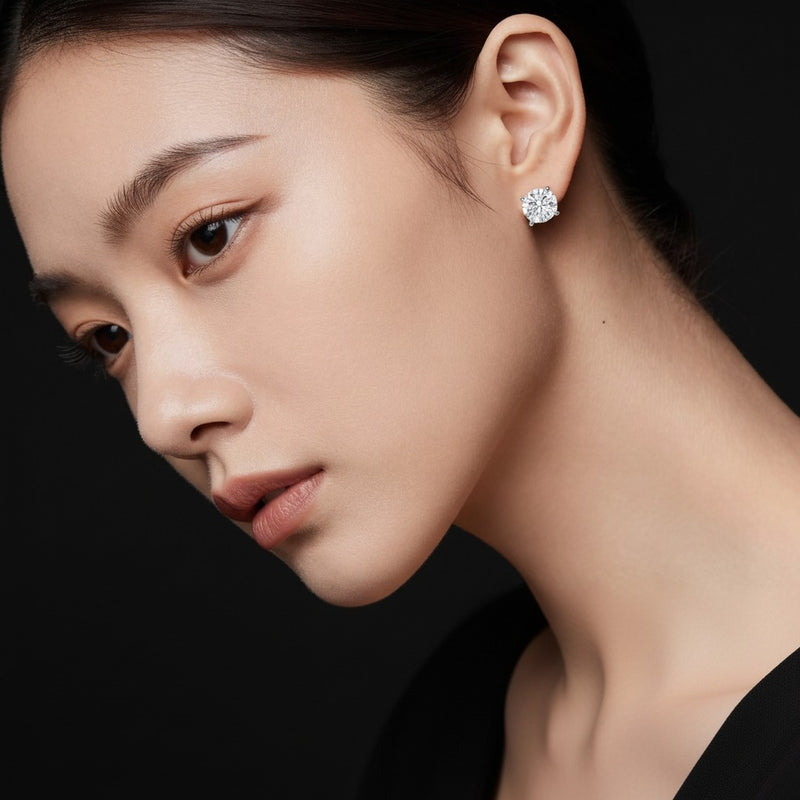 Model wearing round stud earrings