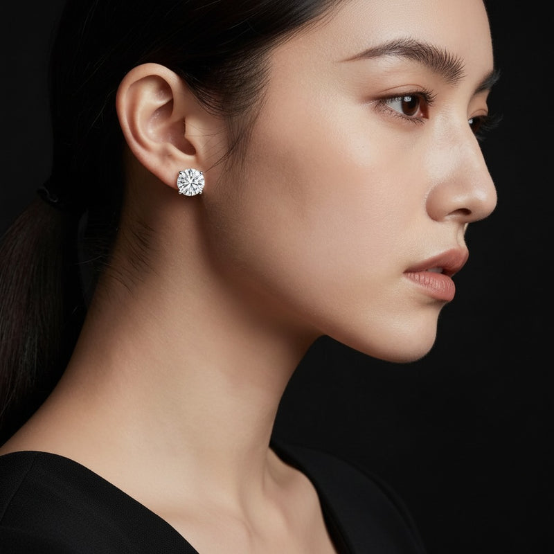Model wearing round stud earrings