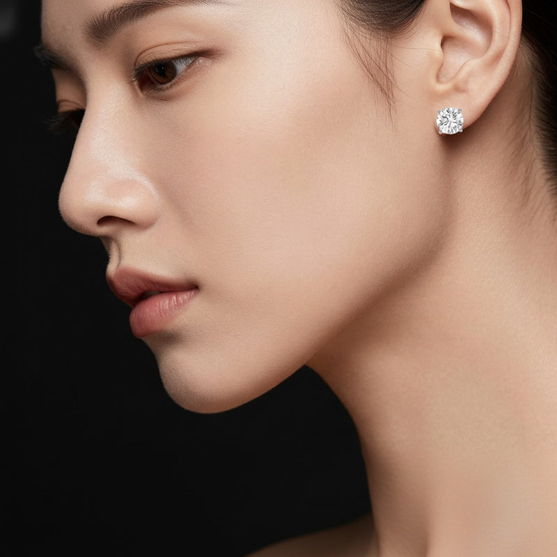 Model wearing round stud earrings