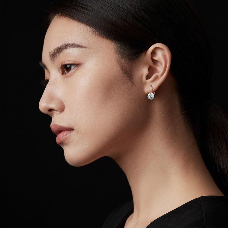 Model wearing round stud earrings