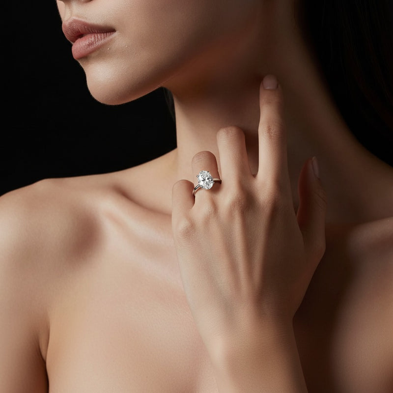 Model wearing oval lab grown diamond classic solitaire ring