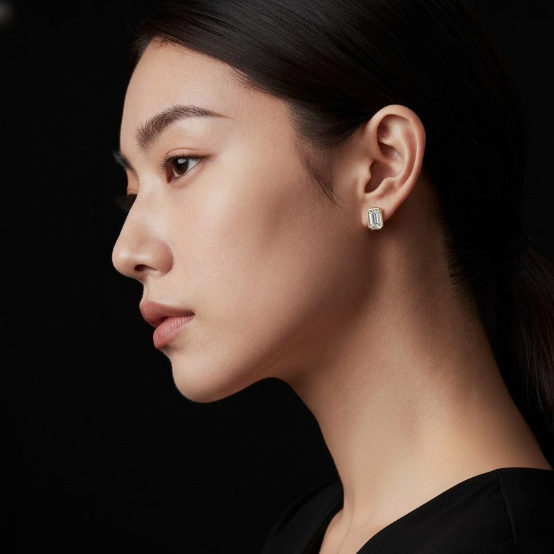 Model wearing radiant bezel set solitaire earrings