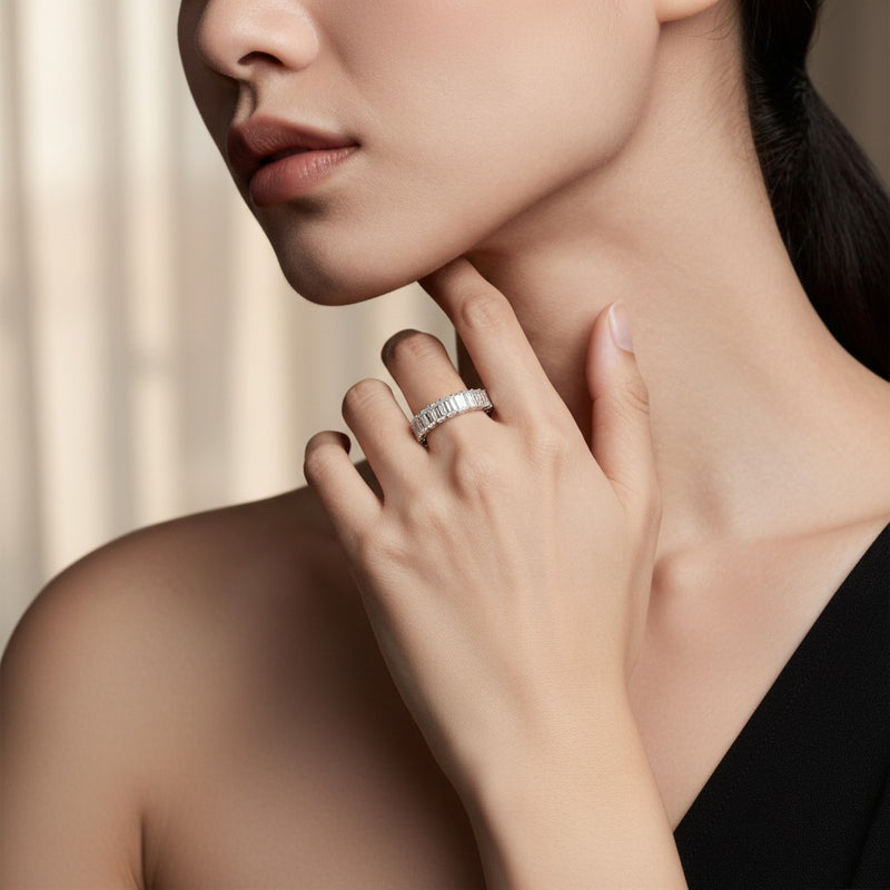 Model wearing emerald lab grown diamond split prong eternity ring