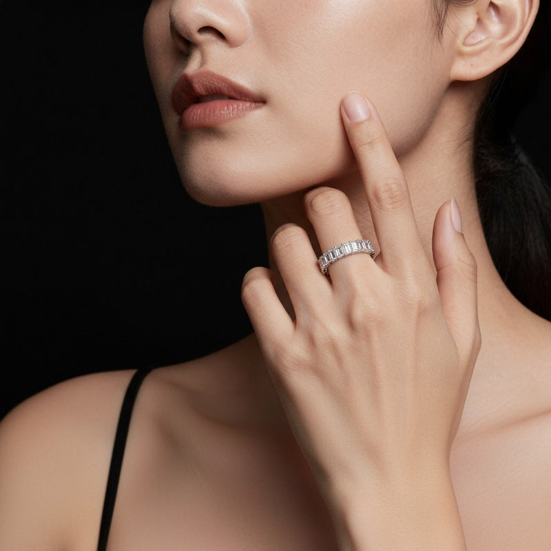 Model wearing emerald lab grown diamond split prong eternity ring