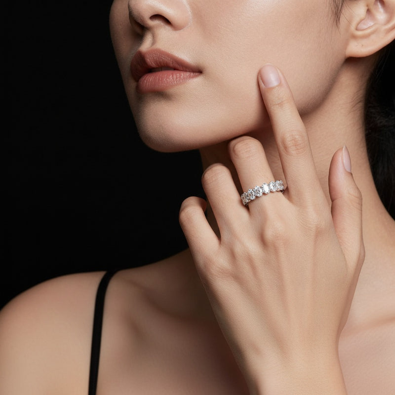 Model wearing oval lab grown diamond split prong eternity ring