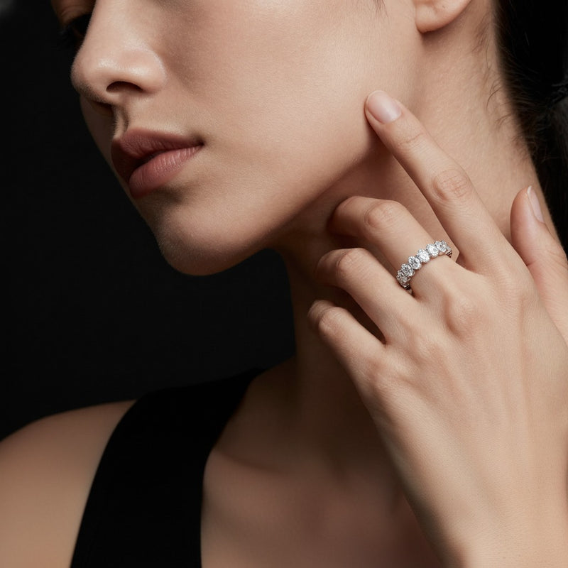Model wearing oval lab grown diamond split prong eternity ring