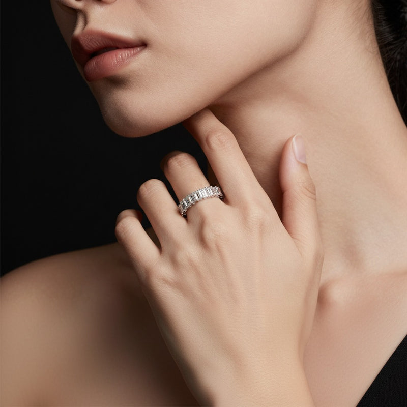 Model wearing emerald lab grown diamond split prong eternity ring